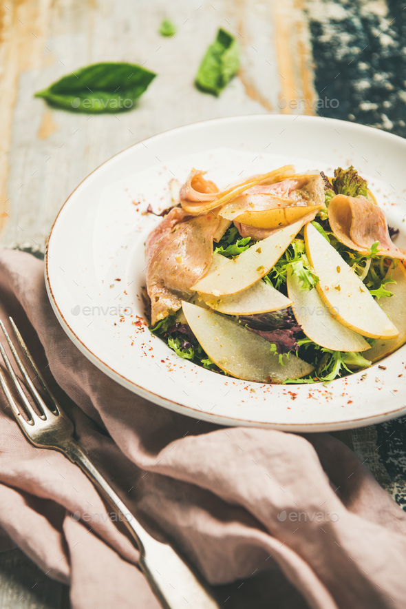 Summer salad with smoked turkey ham and pear slices - Stock Photo - Images