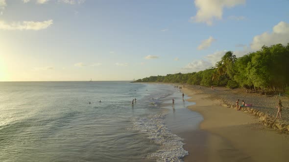 Tourist enjoying on beach on a pleasant day alt