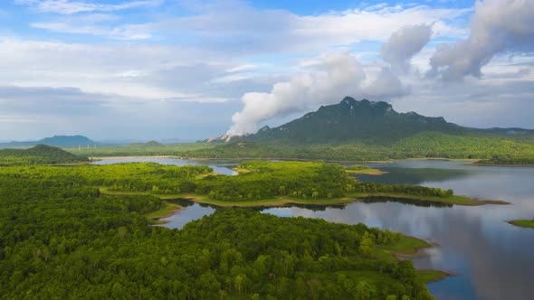 Aerial view, clouds moving over the mountains.