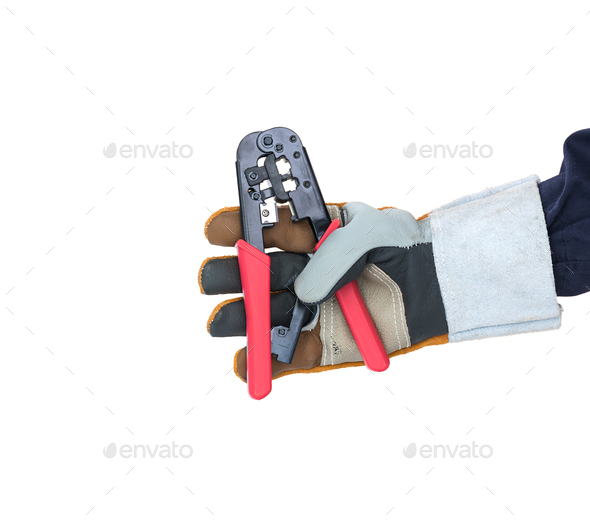 Hand in glove holding wire stripper on white