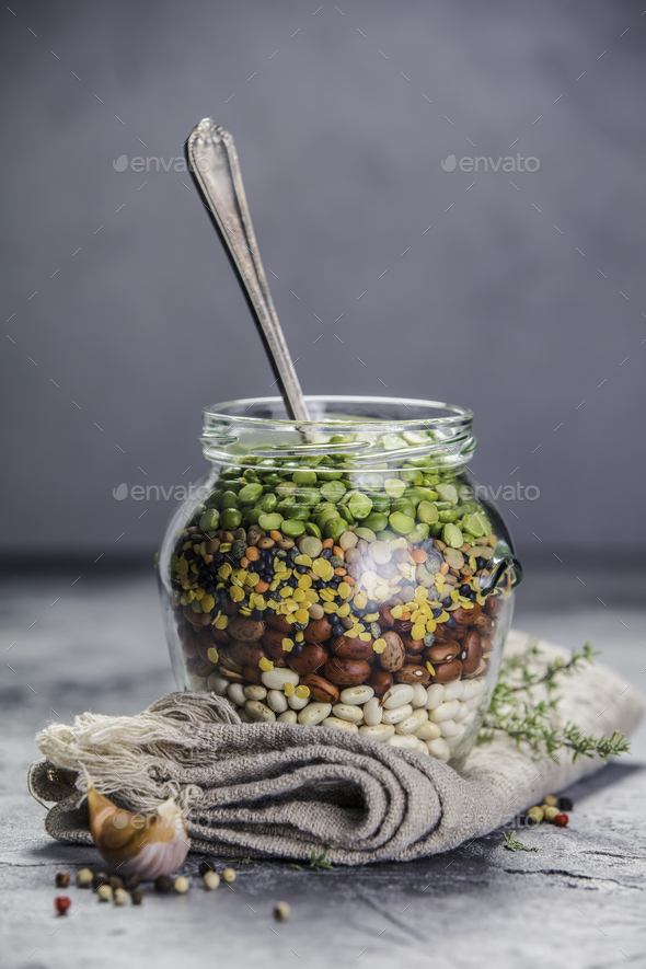 Legumes - lentils chickpeas beans and green peas Stock Photo by klenova