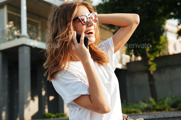 Image of beautiful happy woman wearing casual summer outfit and - Stock Photo - Images
