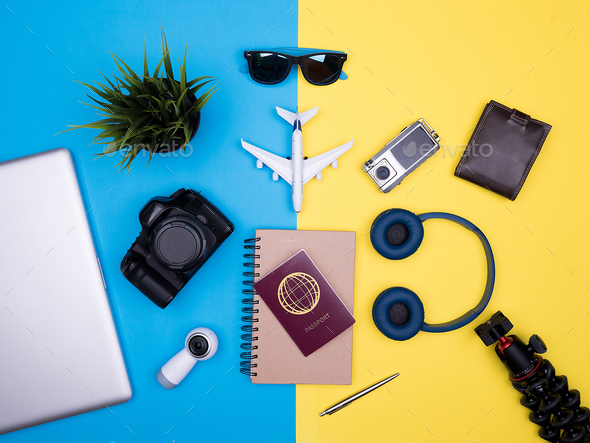 flat lay top view of traveler photographer accessories on yellow background - Stock Photo - Images