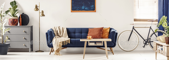 Panorama of a spacious, white living room interior with a retro Stock Photo by bialasiewicz