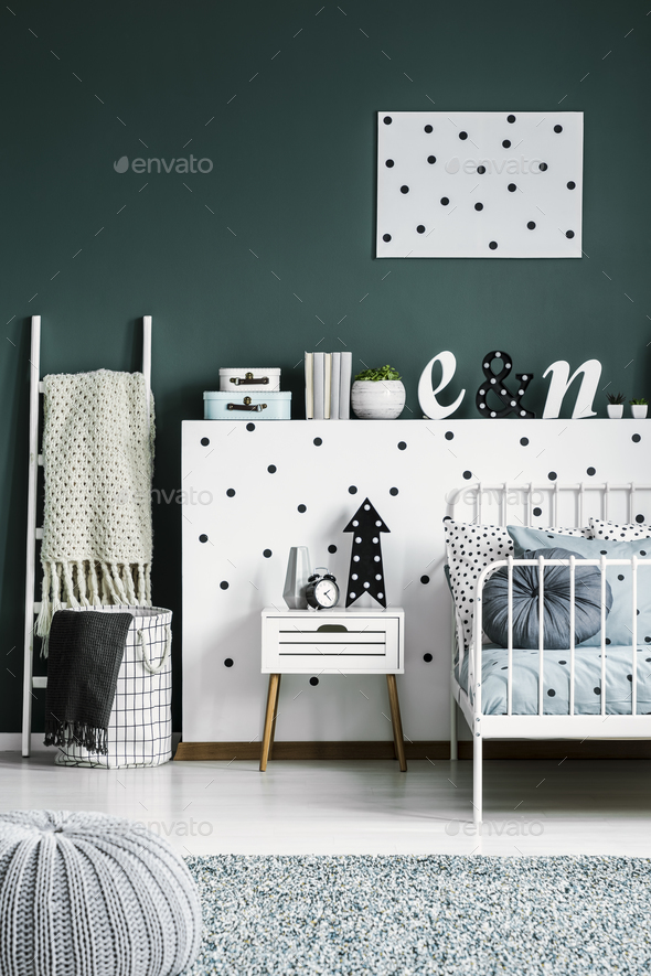Polka dot poster on a dark green walk in a scandinavian style wh Stock Photo by bialasiewicz