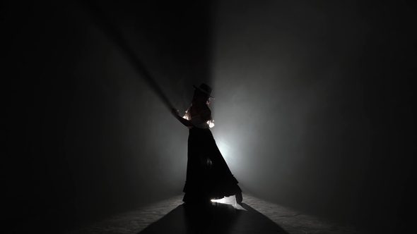 Flamenco Girl Is Dancing in Castanets in Her Hands Dancing Light From Behind Smoke alt
