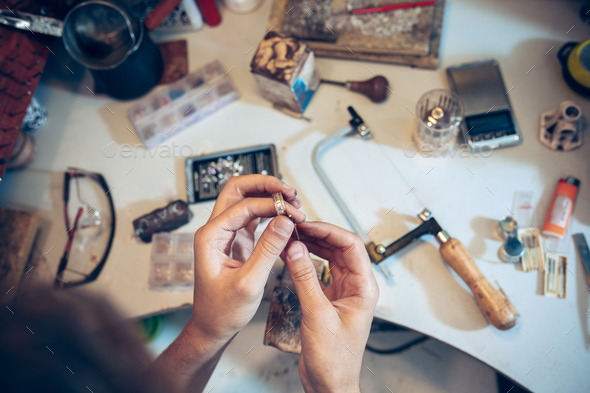 Different goldsmiths tools on the jewelry workplace. Jeweler at work in jewelry. Stock Photo by master1305