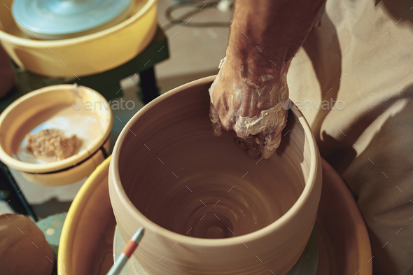 Creating a jar or vase of white clay close-up. Master crock. - Stock Photo - Images