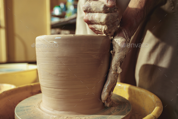 Creating a jar or vase of white clay close-up. Master crock. - Stock Photo - Images