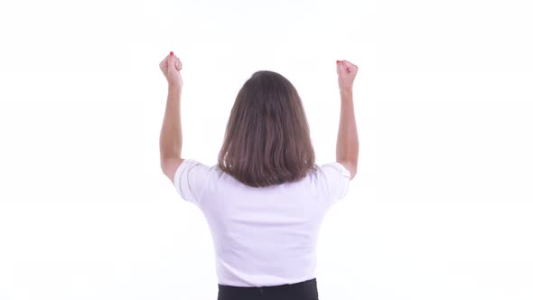 Rear View of Happy Businesswoman with Fists Raised alt