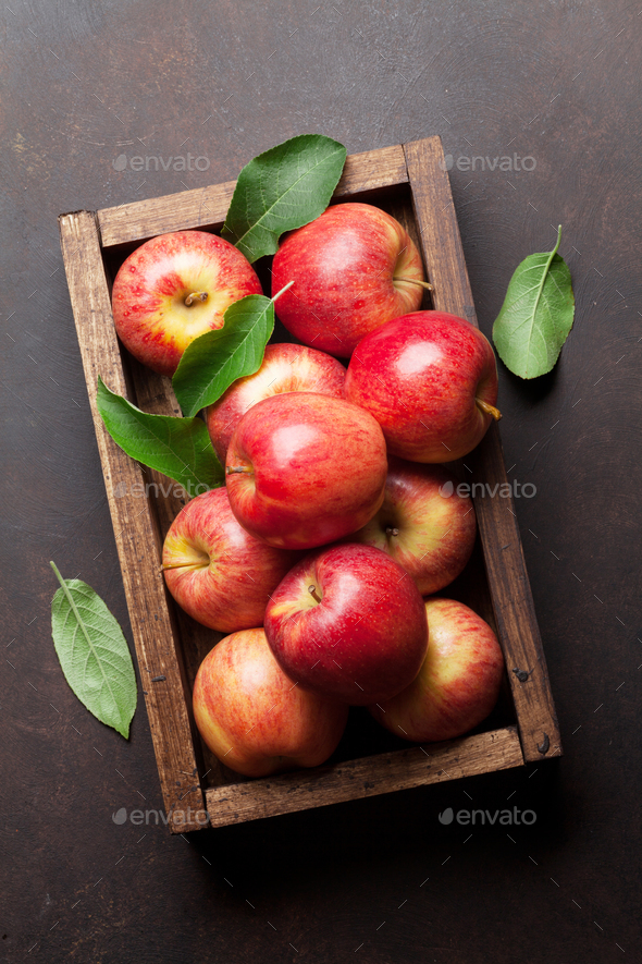Red apples in wooden box - Stock Photo - Images