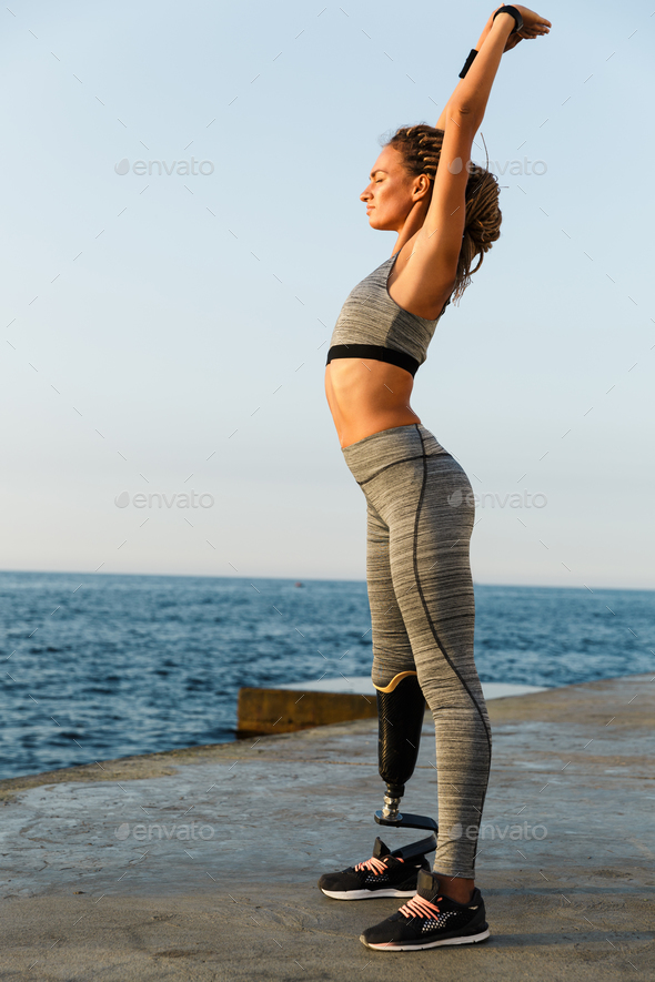 Full length of concentrated disabled athlete woman - Stock Photo - Images