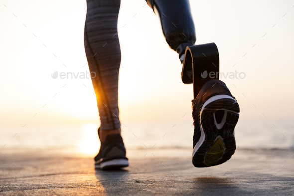 Smiling disabled athlete woman with prosthetic leg Stock Photo
