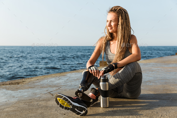 Happy disabled athlete woman with prosthetic leg Stock Photo by ...