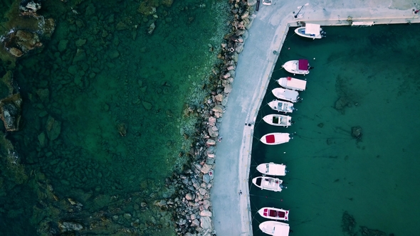 Aerial Top View Onto a Pier with Motorboats Drone Footage