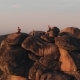 Epic Drone Shot of Friends Enjoy the Sunset Sitting on Top of a High Mountain in the Siberian Stolby - VideoHive Item for Sale