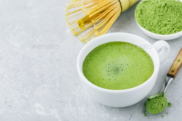 Japanese matcha green tea latte in white cup on gray background Stock Photo  by nblxer