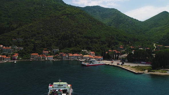 Aerial Beautiful View From Above To Kotor Bay and Regular Passenger Ferry From Lepetane To Kamenari