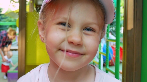 Little Girl Smiling at Children Playground