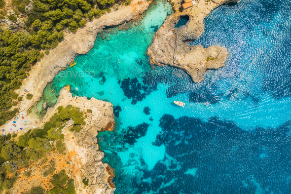Aerial view of seashore with transparent blue water - Stock Photo - Images