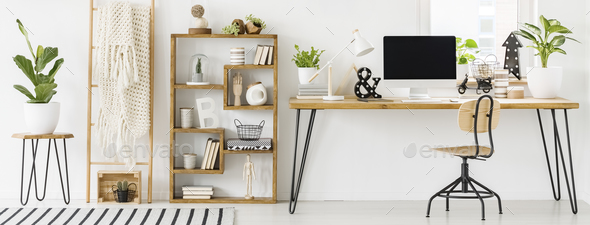 Panorama of a spacious home office interior with a bookcase with Stock Photo by bialasiewicz