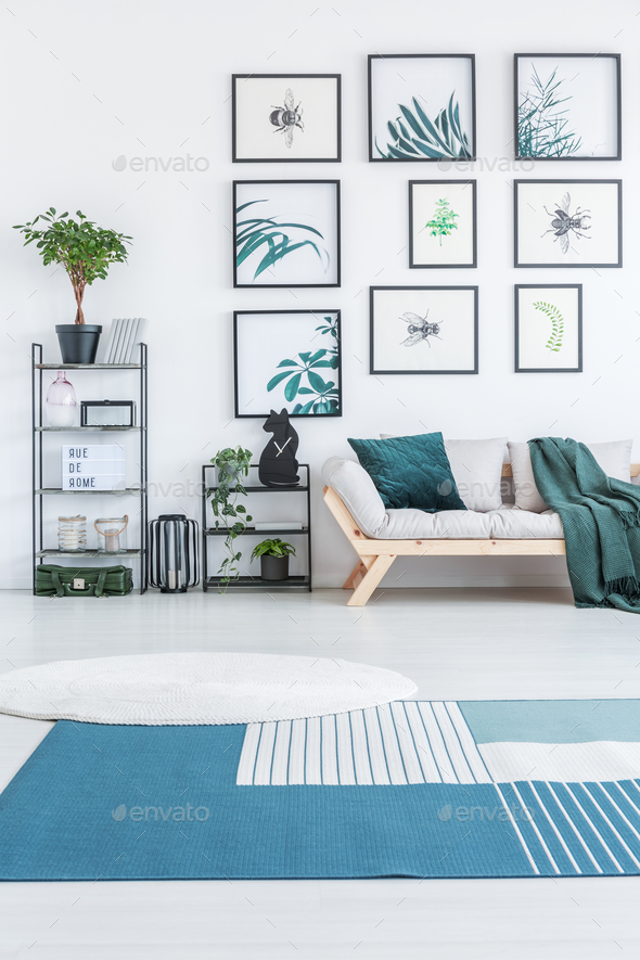 White round rug and blue carpet with stripes placed on the floor - Stock Photo - Images