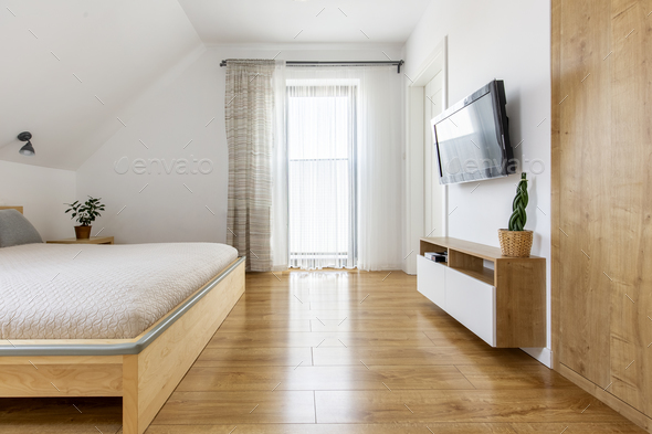 Real photo of a bright and spacious hotel bedroom interior with - Stock Photo - Images