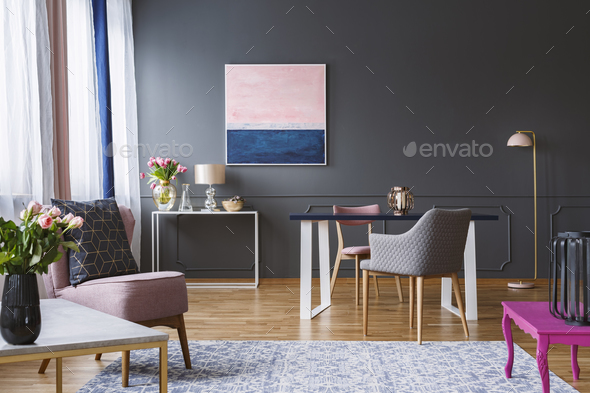 Pink and navy blue painting in grey living room interior with fl Stock Photo by bialasiewicz