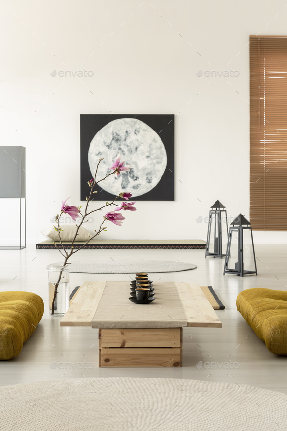 Real photo of a bright, oriental interior with a row of tea cups - Stock Photo - Images