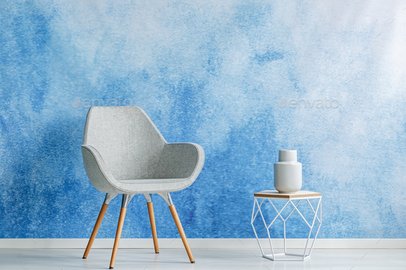 Copy space room interior with simple gray armchair and openwork - Stock Photo - Images