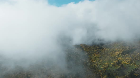 Misty Clouds Covering The Summit Of Pico do Areeiro On Madeira Island, Portugal. Aerial Drone Shot alt