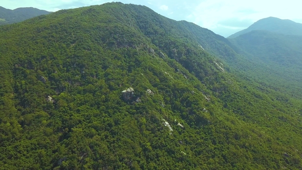 Green Mountain Covered Tropical Trees and Big Stones Aerial View. Beautiful Mountain Landscape From alt