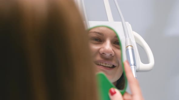 Young Smiling Woman at the Dentist's Reception alt