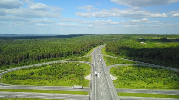 Aerial Shot Movement of Vehicles at a Transport Junction alt