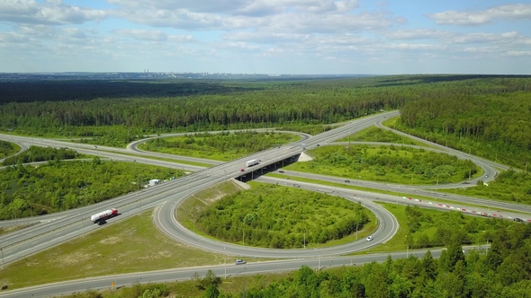 Aerial View Highway with Road Junction and Bridges on a Sunny Summer Day alt