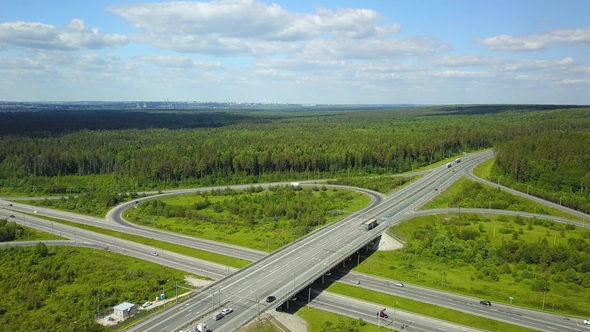 Highway with Transport Interchange. Aerial Shot on a Sunny Summer Day