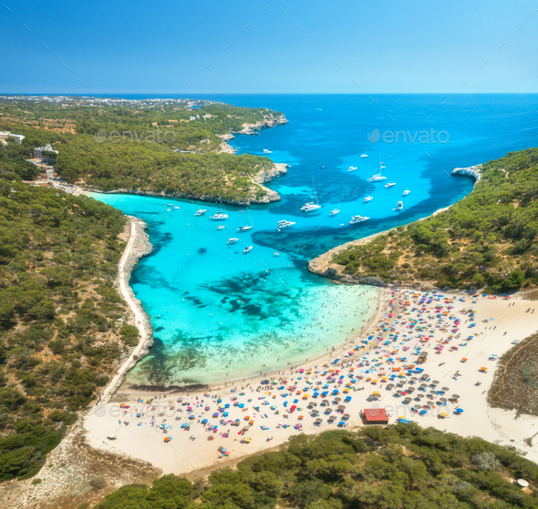 Aerial view of sandy beach, blue sea, people and yachts - Stock Photo - Images