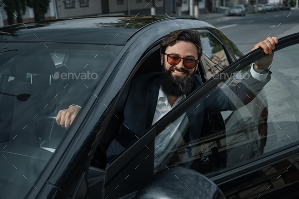 Portrait stylish, handsome man near car outdoors - Stock Photo - Images
