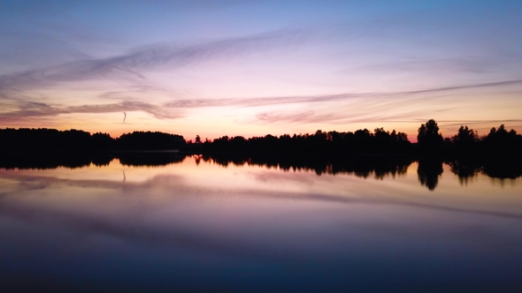 Beautiful Pink Sunset Sky Reflected in the Lake, Aerial View alt