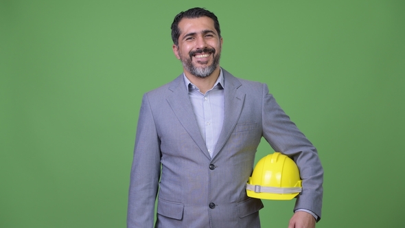 Handsome Happy Persian Bearded Businessman As Engineer Smiling alt