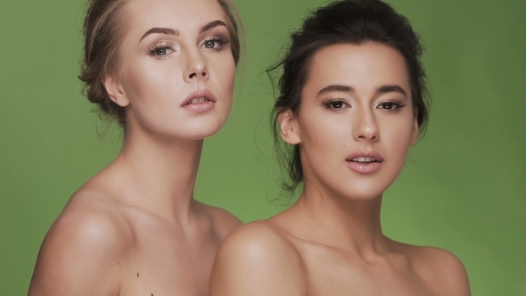 Two Attractive Girls at Studio Background