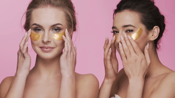 Two Attractive Girls at Studio Background