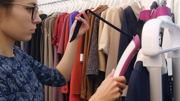 Female Stylist Steaming Blue Dress alt