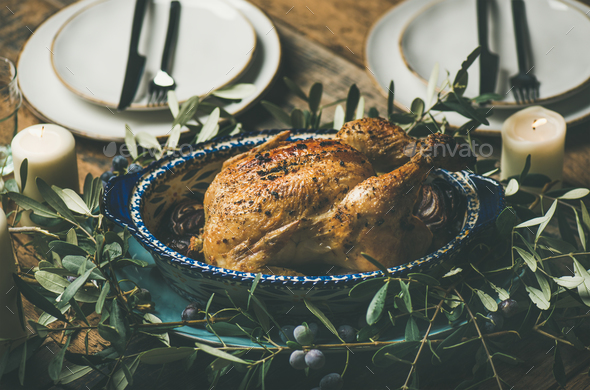 Whole roasted chicken decorated with olive tree branch, selective focus - Stock Photo - Images