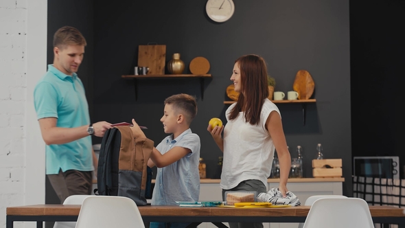 Parents and Schoolboy Preparing To School