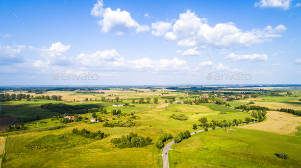 Aerial view of a country road between agricultural fields - Stock Photo - Images