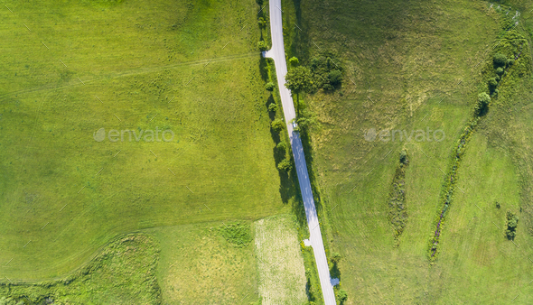 Aerial view of a country road between agricultural fields in Europe Germany - Stock Photo - Images
