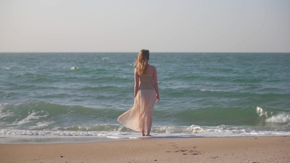 Woman Is Looking on Sea Horizon in Sunny Summer Day Waves Are Washing Her Bare Feet