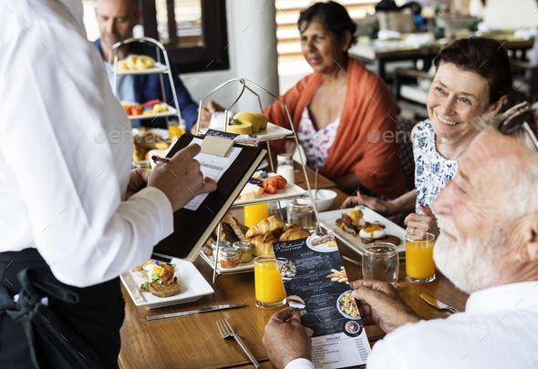 Family eating breakfast at a hotel Stock Photo by Rawpixel | PhotoDune