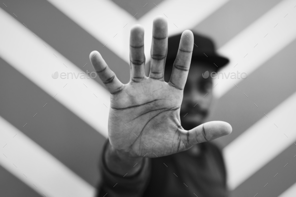 African man doing a "Talk to the hand!" pose Stock Photo by Rawpixel